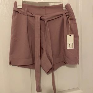 High waisted flowy self tie shorts.